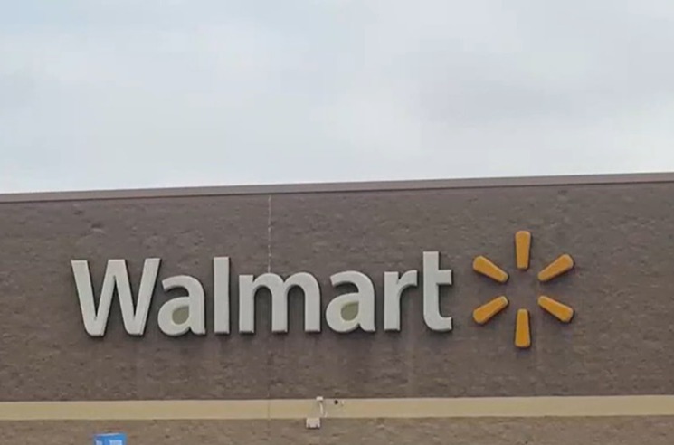 Walmart store exterior with news graphic warning of skimmer scam.