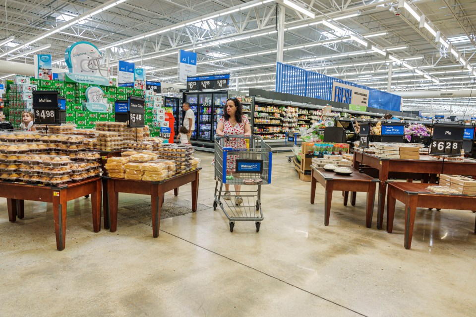 Woman shopping for baked goods in a Walmart.