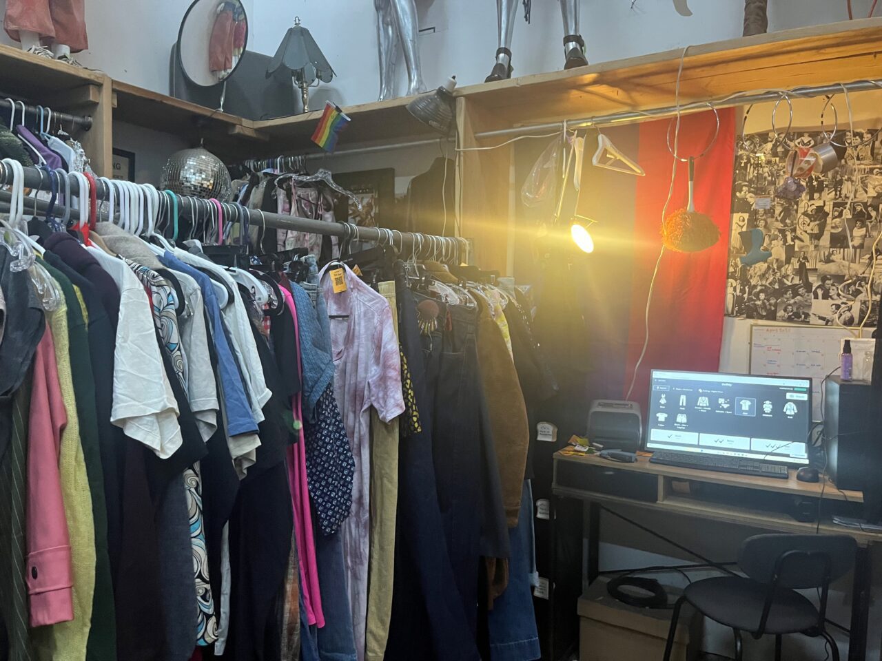 A Thriftly kiosk stationed in the clothing sorting area.