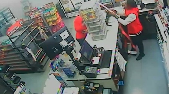 Security footage of a Circle K clerk assisting in the theft of lottery tickets.