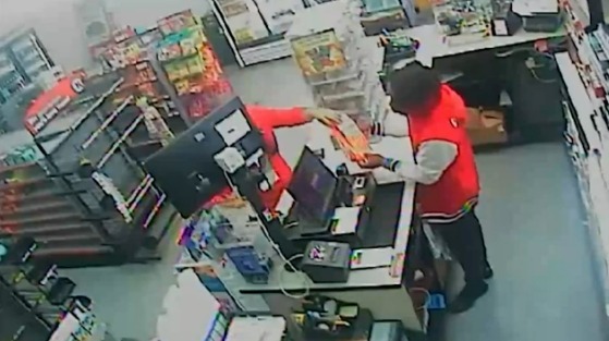 Security footage of a Circle K clerk assisting in the theft of lottery tickets.