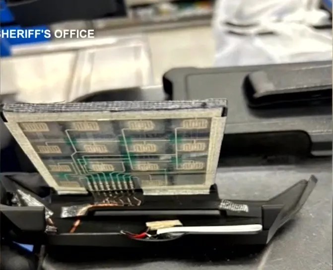 Close-up of a disassembled electronic device's circuit board.