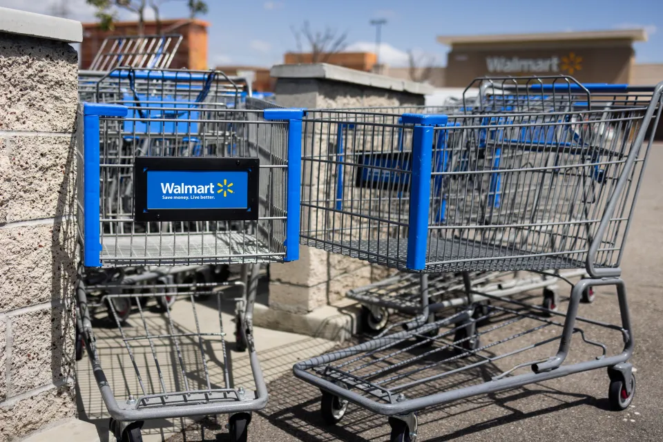 Walmart shopping carts outside a store.