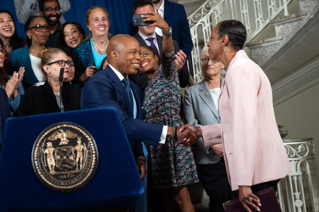 Mayor Eric Adams and New York City Council Speaker Adrienne Adams shake hands to announce an agreement to build on the Fiscal Year (FY) 2026 Executive Budget often called the