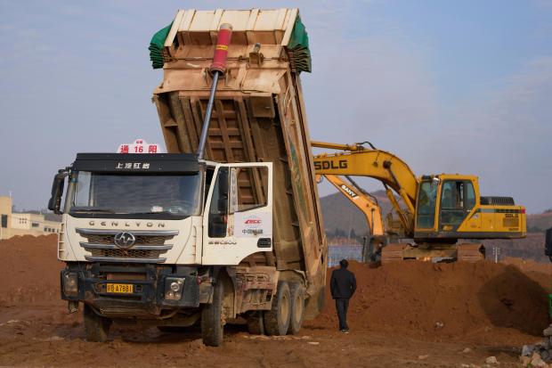 Heavy equipment moves earth in Ganzhou in southern China’s Jiangxi...