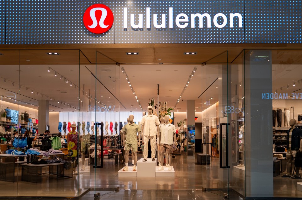 Lululemon store exterior with mannequins visible through the glass doors.
