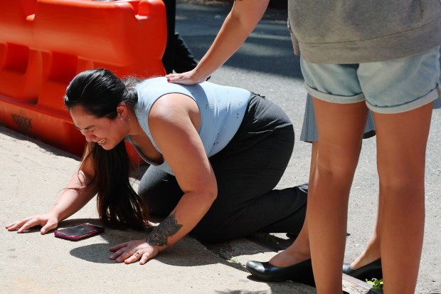 A woman cries after her husband was detained by federal agents following an Intensive Supervision Appearance Program office hearing on June 4, 2025 in New York City. (Photo by Michael M. Santiago/Getty Images)