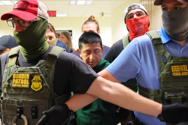 Federal authorities detain a man after attending a court hearing at immigration court at the Jacob K. Javitz Federal Building on July 1, 2025 in New York City. (Photo by Michael M. Santiago/Getty Images)