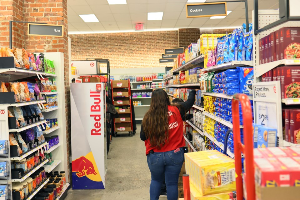 Target employee stocking shelves.