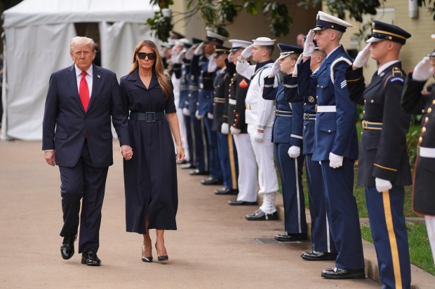 President Donald Trump and first lady Melania Trump arrive to a ceremony to commemorate the 24th anniversary of the 9/11 attacks, Thursday, Sept. 11, 2025, at the Pentagon in Washington. (AP Photo/Evan Vucci)
