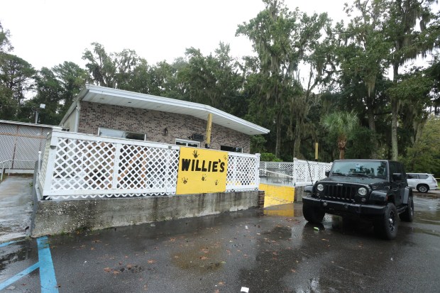 A vehicle is parked outside of Willie's Bar and Grill in St Helena Island, S.C. after a shooting.
