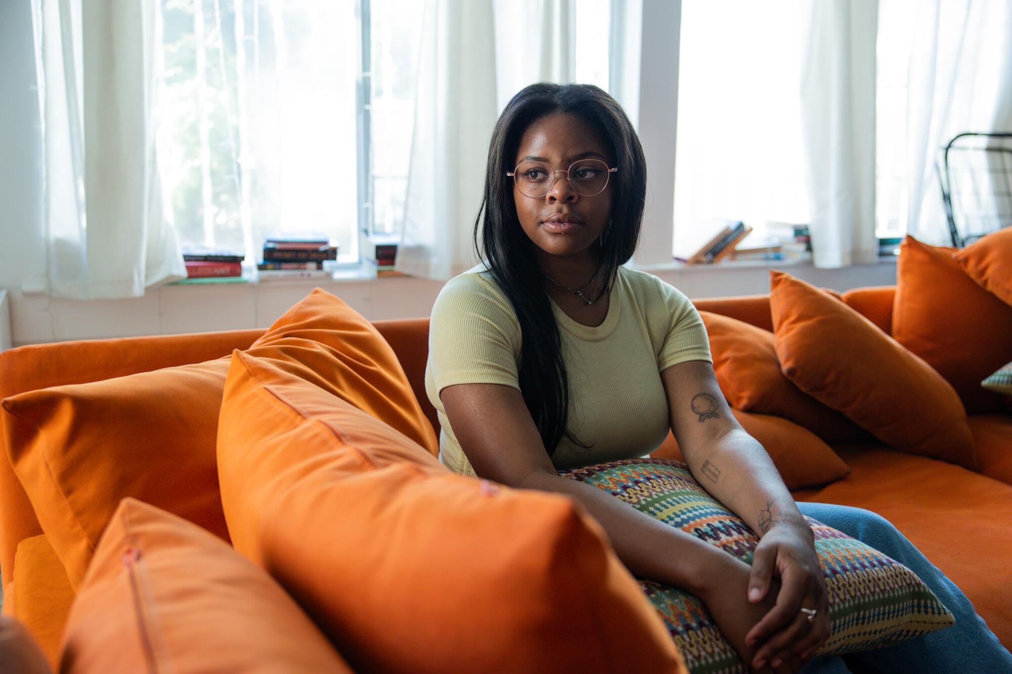 Alexandria Augustine sits for a portrait at her home on Wednesday, Nov. 26, 2025 in West Hollywood.