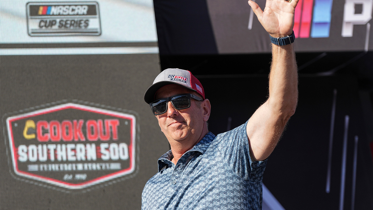 Former driver Greg Biffle waves to fans prior to a NASCAR Cup Series auto race at Darlington Raceway, Aug. 31, 2025, in Darlington, S.C.