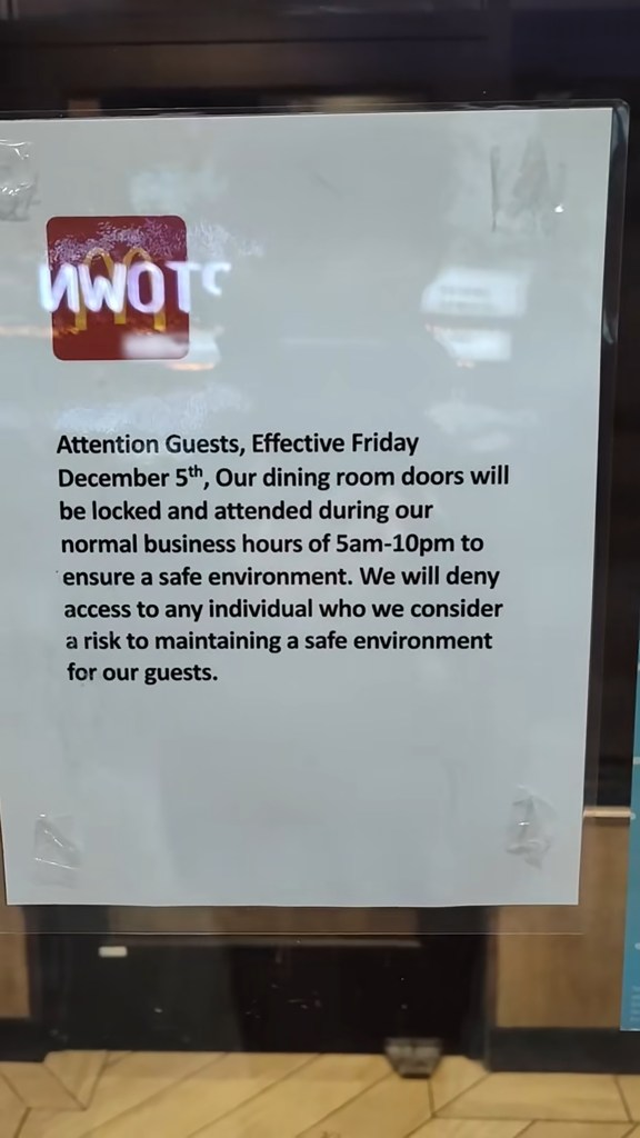 A notice from a McDonald's restaurant stating dining room doors will be locked and attended from 5am-10pm to ensure safety and deny access to individuals deemed a risk.