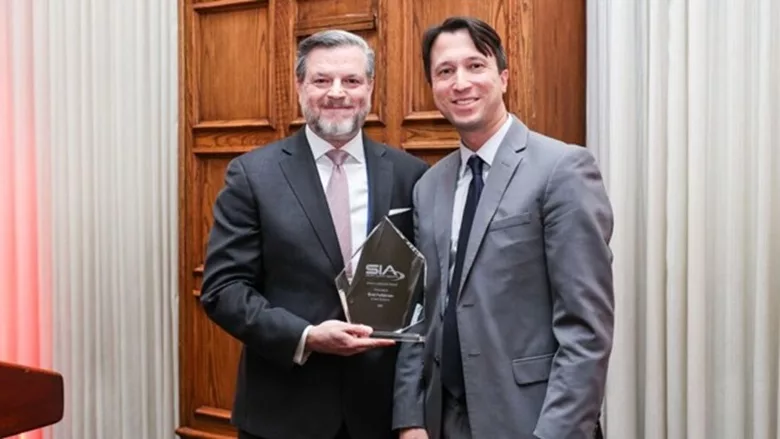 Brett-Feddersen-Accepting-SIA-Industry-Advocate-Award.webp