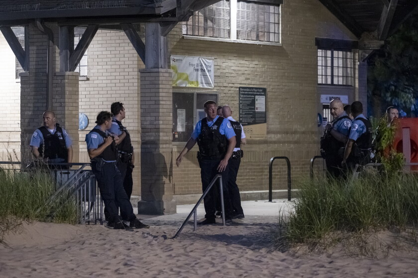 Chicago police officers and around and chat with one another at Foster Beach over fears of a teen takeover, Thursday, June 4, 2026.